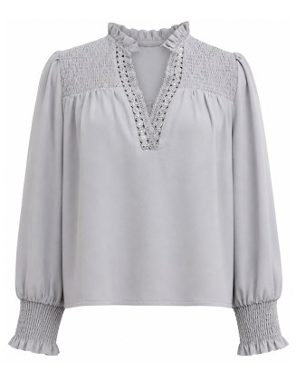 Light gray blouse with a ruffled collar