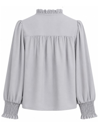 Light gray blouse with a ruffled collar